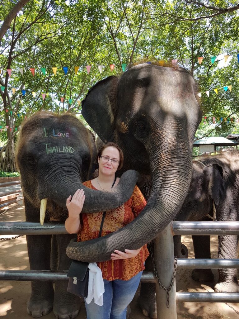 Jeanne in Thailand, playing with her Elephants, 2014