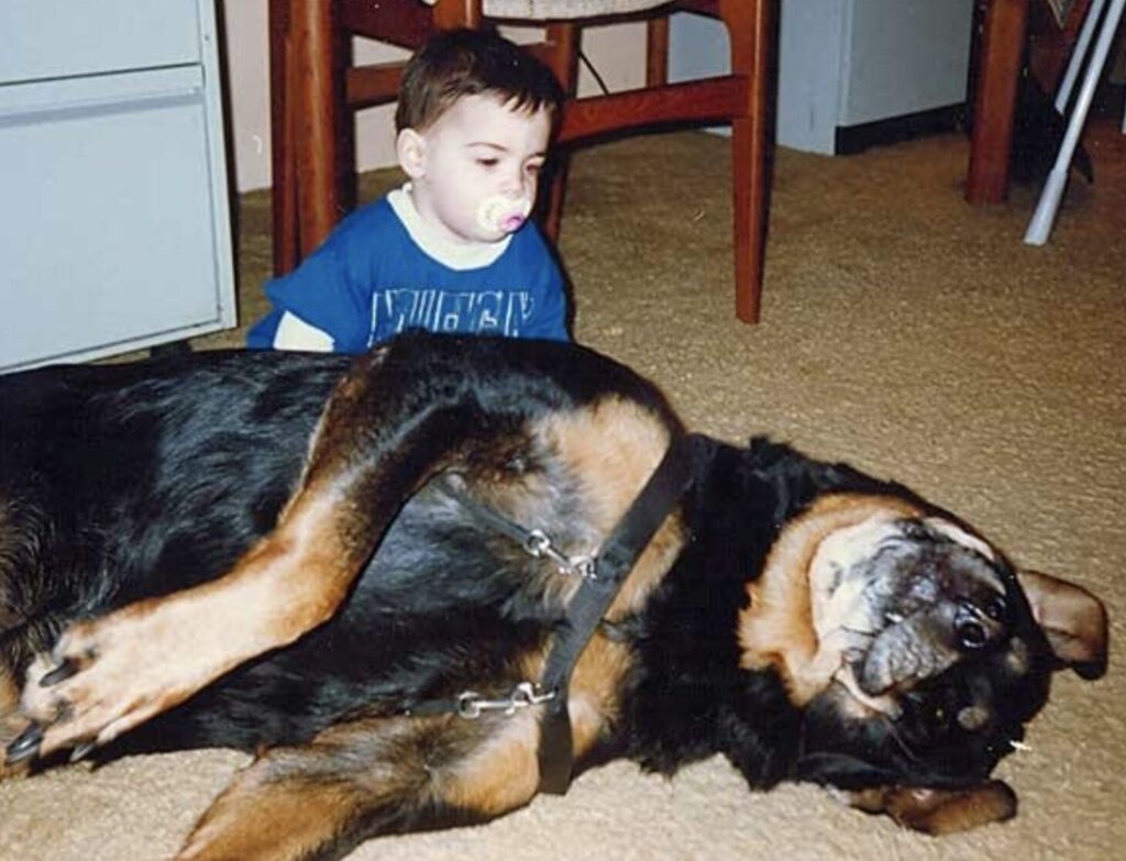 William with our massive Rottweiler, Max, 1995 or 1996.